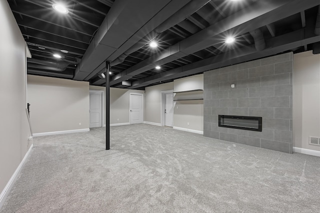 835 Crestwood Ln, Rochester Hills, MI 48309 - finished basement featuring baseboards, carpet flooring, and a large fireplace