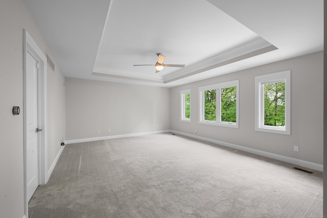 835 Crestwood Ln, Rochester Hills, MI 48309 - carpeted empty room featuring a tray ceiling, a ceiling fan, and baseboards