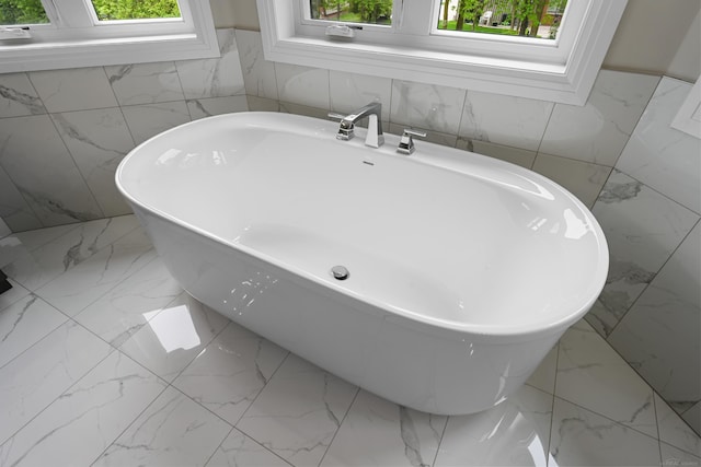 835 Crestwood Ln, Rochester Hills, MI 48309 - full bath with marble finish floors, tile walls, and a freestanding tub
