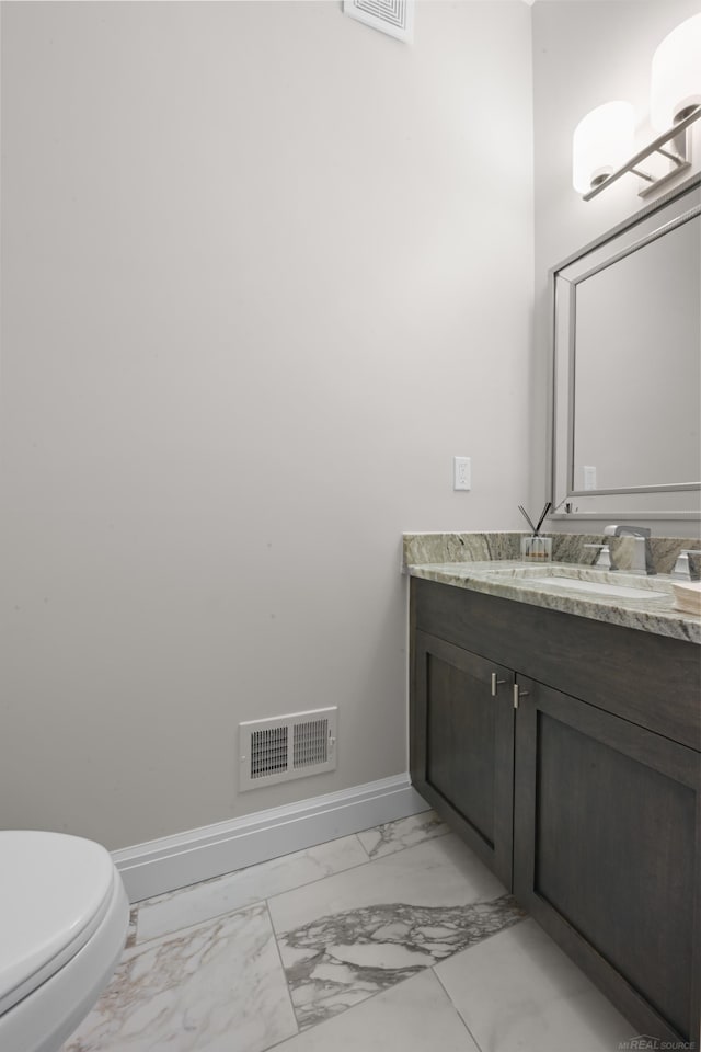 835 Crestwood Ln, Rochester Hills, MI 48309 - bathroom featuring marble finish floors, baseboards, vanity, and toilet