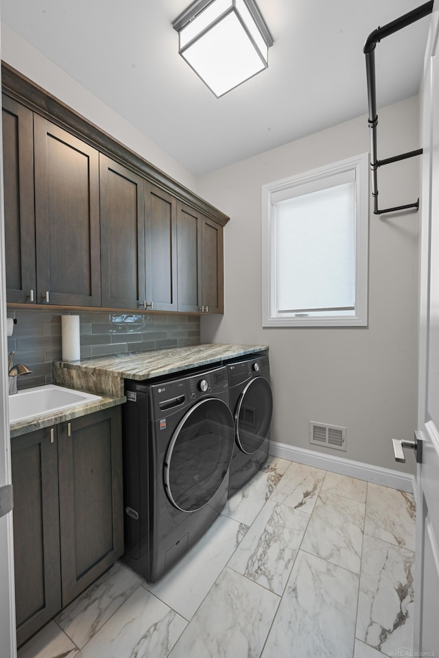 835 Crestwood Ln, Rochester Hills, MI 48309 - laundry area with cabinet space, washing machine and clothes dryer, baseboards, and light marble finish flooring