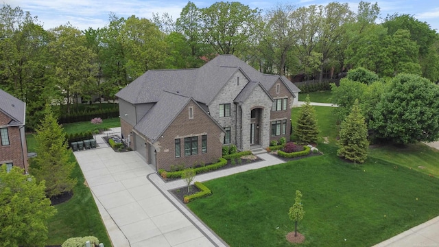 835 Crestwood Ln, Rochester Hills, MI 48309 - french country home featuring driveway, brick siding, a front yard, and an attached garage
