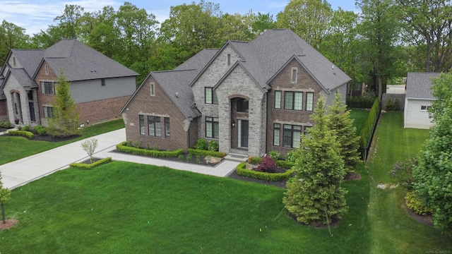 835 Crestwood Ln, Rochester Hills, MI 48309 - french country style house featuring brick siding, a front lawn, and stone siding