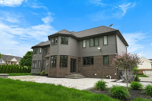 835 Crestwood Ln, Rochester Hills, MI 48309 - back of house featuring brick siding, a patio area, and a shingled roof