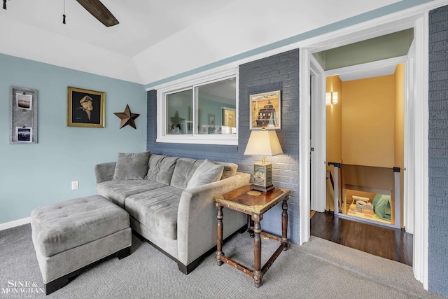 living room with carpet flooring and a ceiling fan