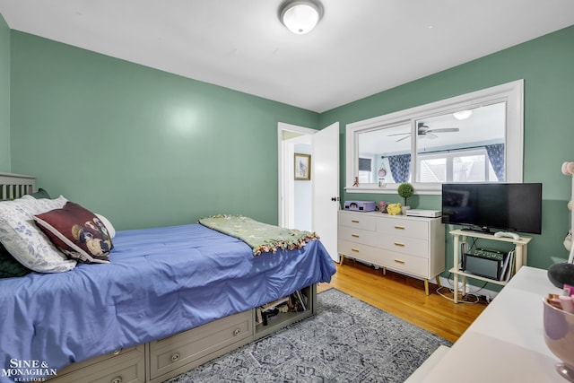 bedroom with wood finished floors