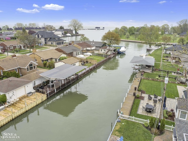 aerial perspective of suburban area featuring a nearby body of water