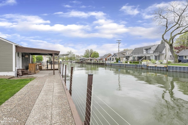 dock featuring a water view and a residential view