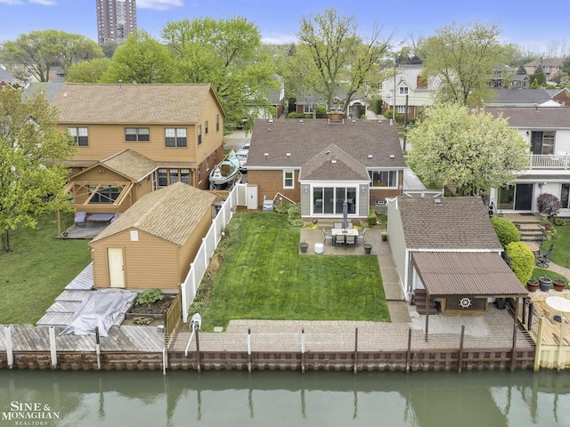 aerial view of residential area with a nearby body of water