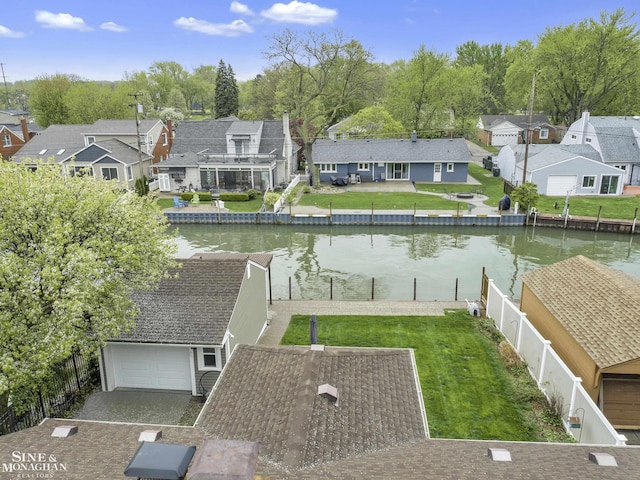 aerial view of residential area with a nearby body of water