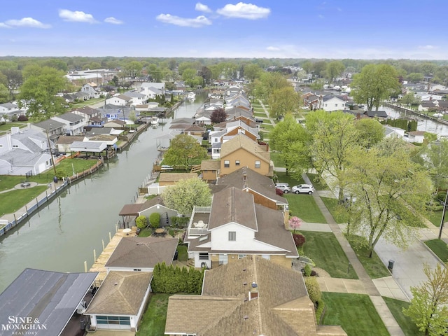 view of property location with nearby suburban area and a large body of water