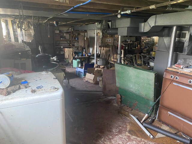unfinished basement with washer / dryer