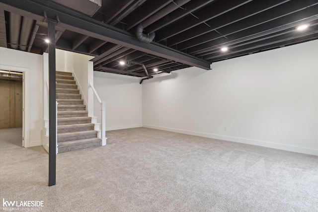 21168 Lilac Ln, Clinton Township, MI 48036 - finished basement with carpet flooring, stairs, and baseboards