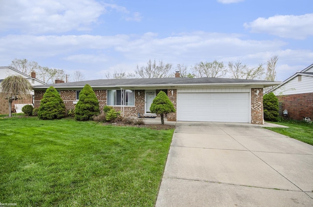 view of front of property with brick siding, concrete driveway, an attached garage, and a front yard