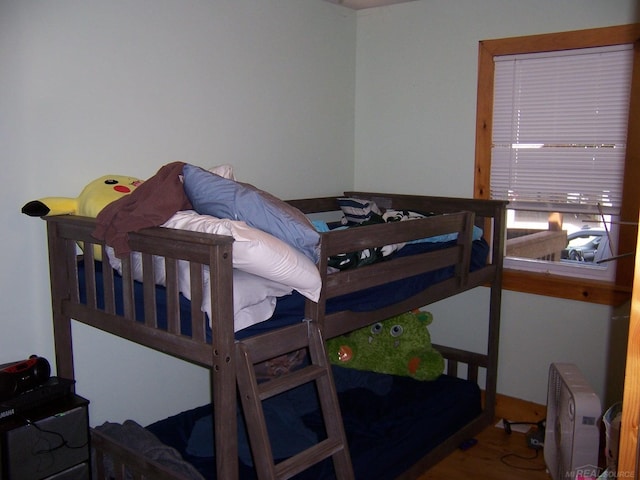 bedroom with wood finished floors