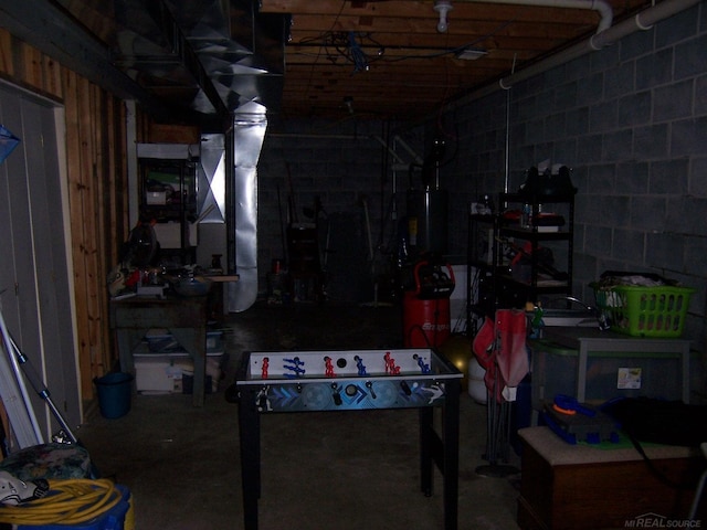below grade area featuring concrete block wall