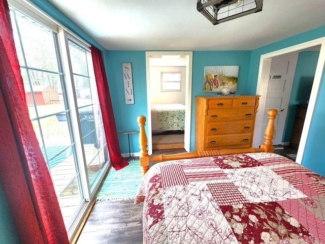 6494 Birch St, Gladwin, MI 48624 - bedroom featuring wood finished floors and baseboards