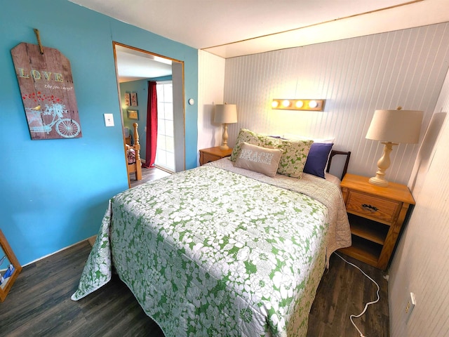 6494 Birch St, Gladwin, MI 48624 - bedroom featuring wood finished floors