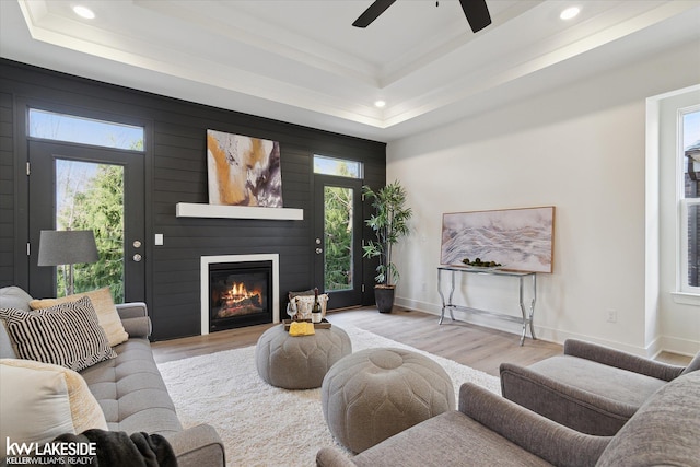 40699 Azalea Ln, Clinton Township, MI 48036 - living room featuring a raised ceiling, recessed lighting, wood finished floors, a ceiling fan, and a fireplace