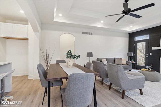 40699 Azalea Ln, Clinton Township, MI 48036 - dining area featuring a raised ceiling, light wood finished floors, arched walkways, recessed lighting, and a ceiling fan