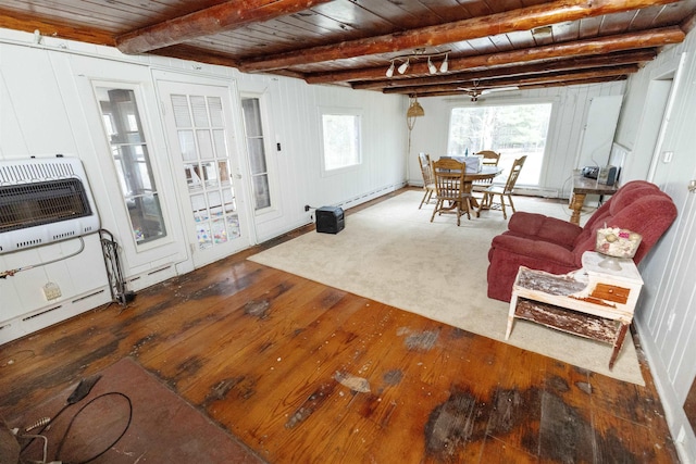 4440 W Cherry Creek Rd, Lewiston, MI 49756 - living room featuring hardwood / wood-style floors, a wood ceiling with exposed beams, heating unit, and plenty of natural light