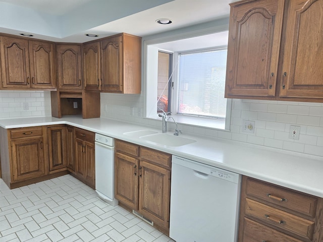 2707 Inverness Dr, Bay City, MI 48706 - kitchen featuring dishwasher, a sink, tasteful backsplash, light countertops, and recessed lighting