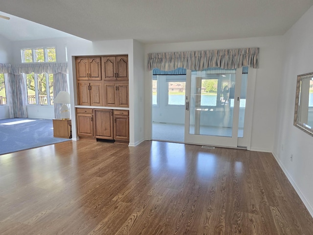 2707 Inverness Dr, Bay City, MI 48706 - unfurnished living room featuring wood finished floors, baseboards, and ceiling fan