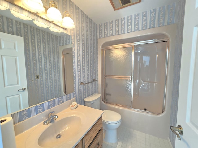 2707 Inverness Dr, Bay City, MI 48706 - full bathroom featuring wallpapered walls, vanity, toilet, tile patterned floors, and bath / shower combo with glass door