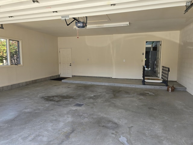 2707 Inverness Dr, Bay City, MI 48706 - garage featuring a garage door opener