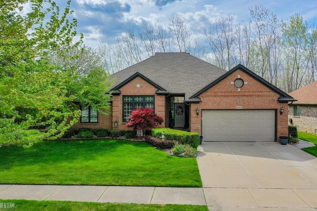 traditional-style home with brick siding, a garage, driveway, a front yard, and roof with shingles