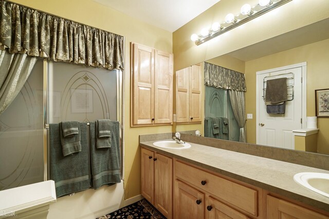 bathroom with double vanity