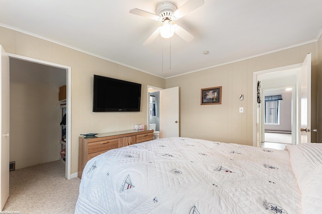 bedroom with ornamental molding, light carpet, a spacious closet, and a ceiling fan