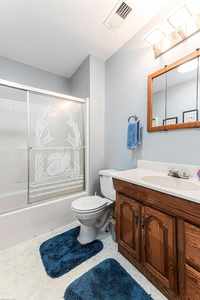 full bath featuring shower / bath combination with glass door, toilet, and vanity