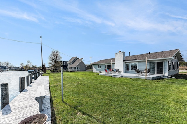 dock area featuring a yard and a patio