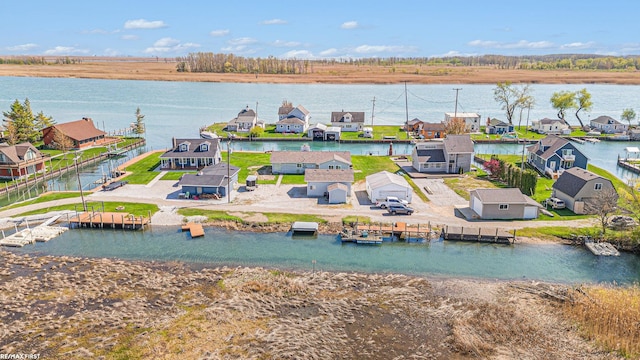 aerial perspective of suburban area with a large body of water