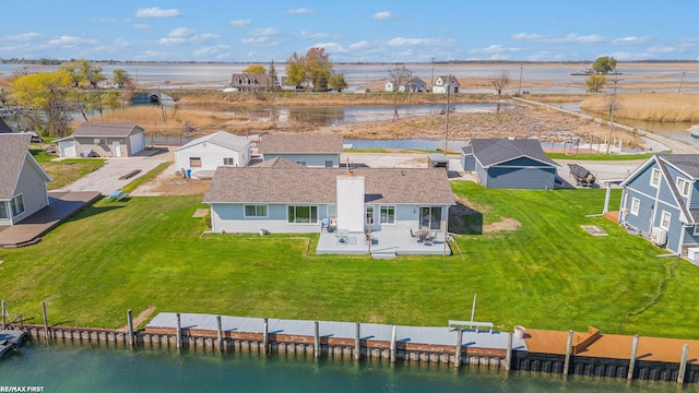 aerial perspective of suburban area with a large body of water