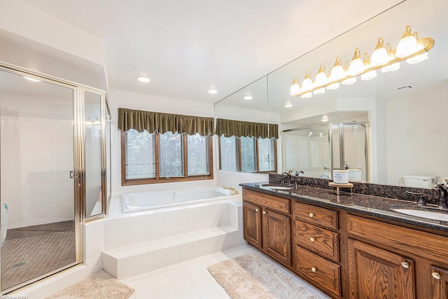 full bathroom with a garden tub, toilet, a stall shower, tile patterned floors, and double vanity