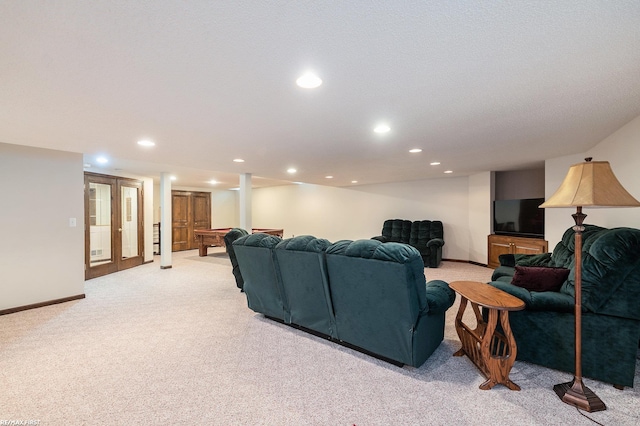 living room featuring light carpet, baseboards, and recessed lighting
