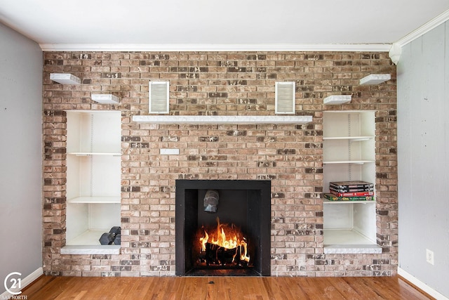 6424 Hunters Creek Rd, Imlay City, MI 48444 - detailed view of wood finished floors, a fireplace, baseboards, and crown molding