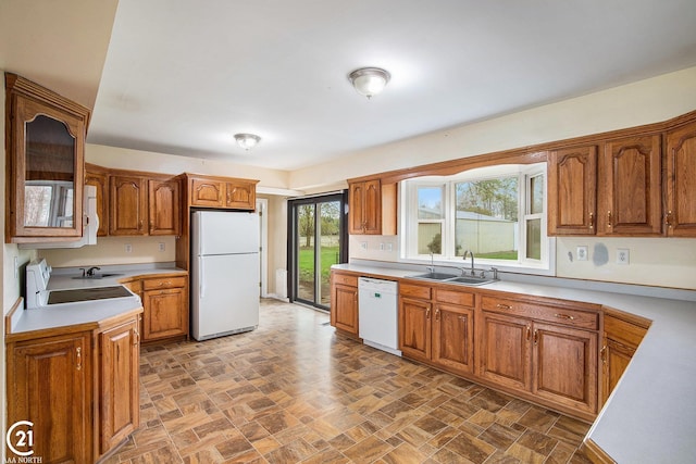 6424 Hunters Creek Rd, Imlay City, MI 48444 - kitchen featuring white appliances, a sink, light countertops, and brown cabinets