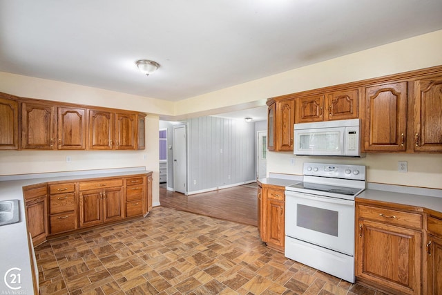 6424 Hunters Creek Rd, Imlay City, MI 48444 - kitchen featuring white appliances and brown cabinetry