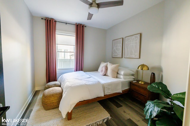 bedroom featuring wood finished floors, ceiling fan, and baseboards