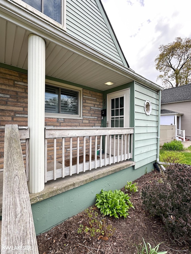 property entrance featuring covered porch