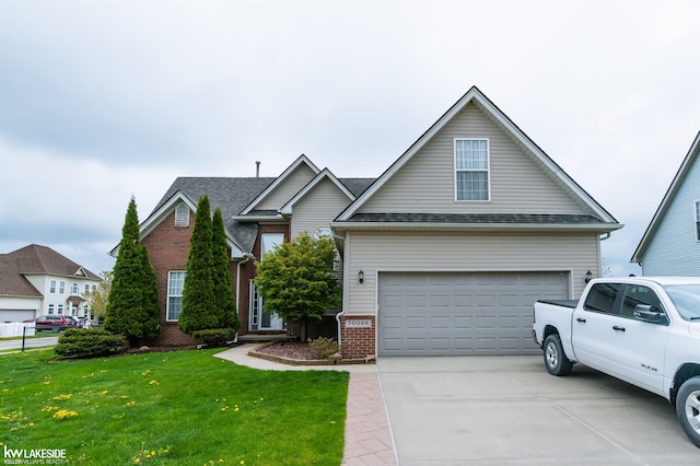 70066 Natures Way, Richmond, MI 48062 - traditional home featuring brick siding, a front yard, concrete driveway, and a garage