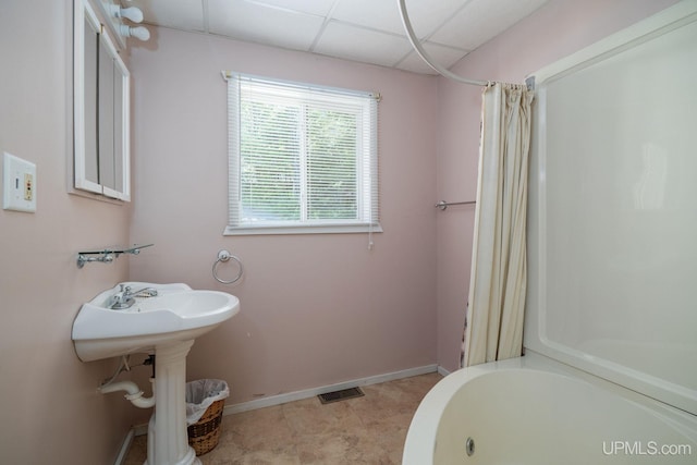 25358 Branch Rd, Michigamme, MI 49861 - full bathroom featuring baseboards and a drop ceiling