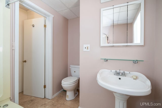 25358 Branch Rd, Michigamme, MI 49861 - bathroom featuring toilet, baseboards, tile patterned flooring, and a sink