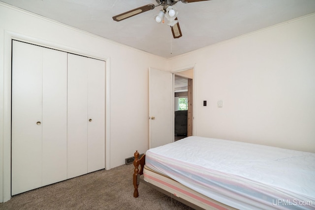 25358 Branch Rd, Michigamme, MI 49861 - carpeted bedroom with a closet, a ceiling fan, and ornamental molding