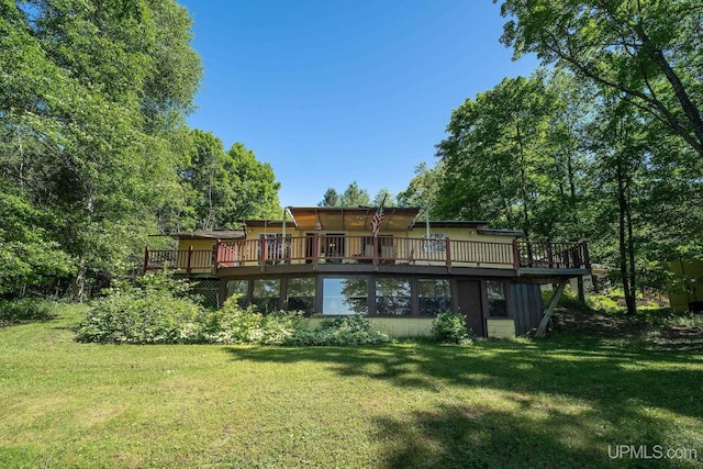 25358 Branch Rd, Michigamme, MI 49861 - rear view of property featuring a wooden deck and a lawn