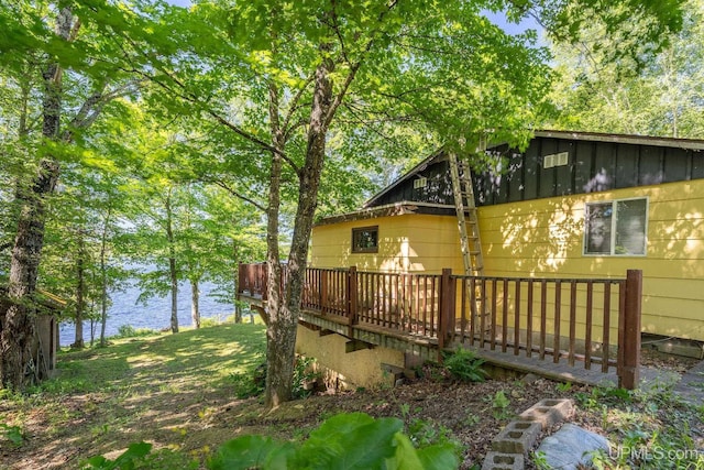 25358 Branch Rd, Michigamme, MI 49861 - view of home's exterior featuring a deck with water view and board and batten siding