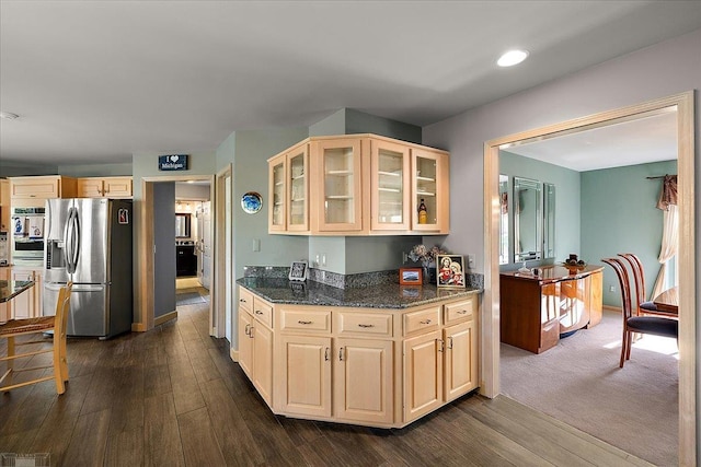 53633 Cherrywood Dr, Shelby Twp, MI 48315 - kitchen with stainless steel refrigerator with ice dispenser, dark wood-style floors, glass insert cabinets, dark stone countertops, and light brown cabinetry